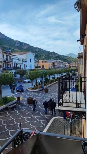 a group of people standing in a parking lot at casa Fontana in Capaci