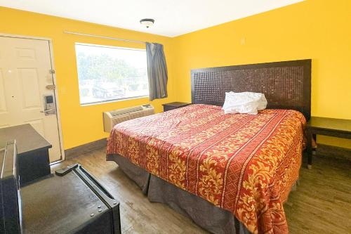 Katil atau katil-katil dalam bilik di Luxury Inn By OYO Albany