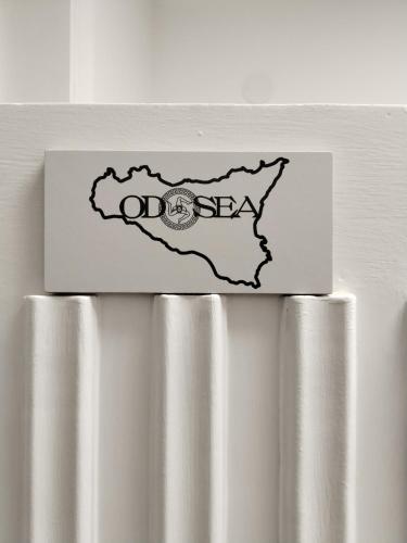 a sticker on the top of a refrigerator at Odysea in Comiso