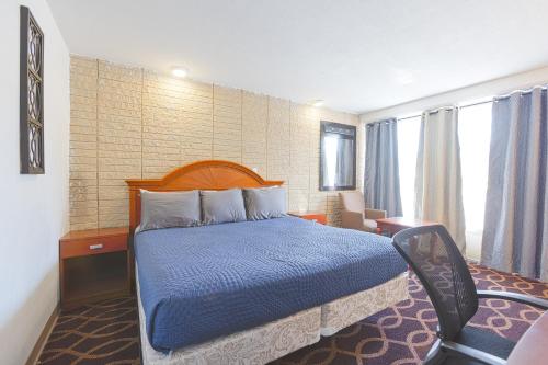 Ένα ή περισσότερα κρεβάτια σε δωμάτιο στο Sonrise Inn Lincoln Hwy By OYO