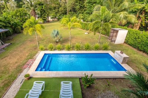 an image of a swimming pool in a yard at Relax in Paradise - Villa Infiniti in Talamanca
