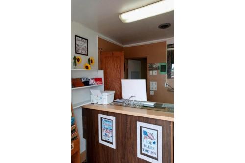 a kitchen with a counter in a room at Love Hotels Murdo by OYO on Interstate 90 in Murdo