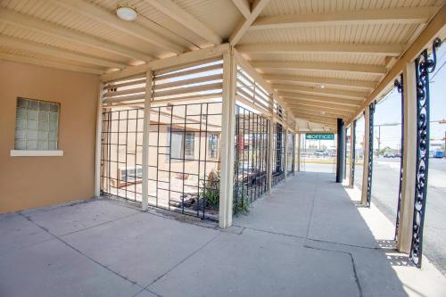 an empty building with a covered walkway at Sands Motel By OYO El Paso near Airport in El Paso