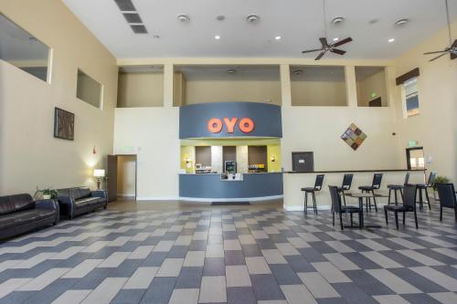 a lobby with a yeso sign on the wall at OYO Hotel Knoxville TN Cedar Bluff I-40 in Knoxville