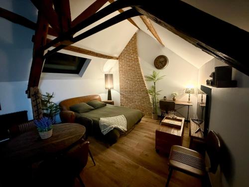 Een zitgedeelte bij L'Evidence, appartement authentique - Epernay