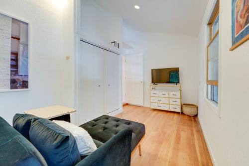 a living room with a couch and a television at Near Dtwn and Pioneer Park Home with Furnished Patio in Nevada City