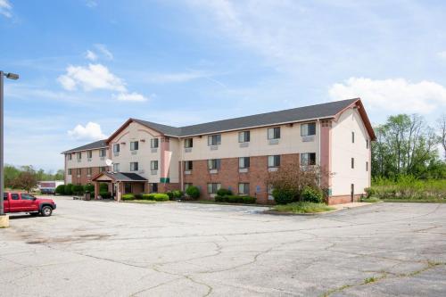 an empty parking lot in front of a building at OYO Hotel Portage I-94 in Portage