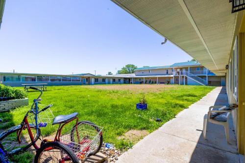 a couple of bikes parked on the side of a building at Country Hearth Inn & Suites By OYO Sturgis in Sturgis