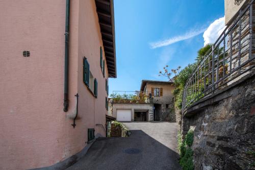 an alley between two buildings in an italian town at Casa Banfi in Brissago