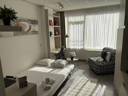 Postel nebo postele na pokoji v ubytování Charming Studio in Central Brussels - Walk Everywhere!