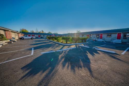 an empty parking lot in front of a building at OYO Hotel Portland OR near Airport in Gresham