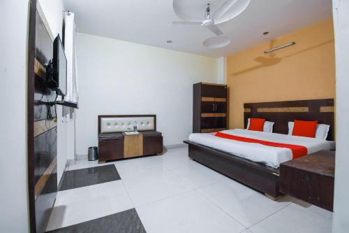 Ένα ή περισσότερα κρεβάτια σε δωμάτιο στο Hotel O Pearl Motichur Railway station