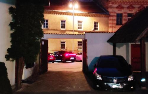 a car parked in a parking lot at night at Prime Location Apartment Vilnius in Vilnius
