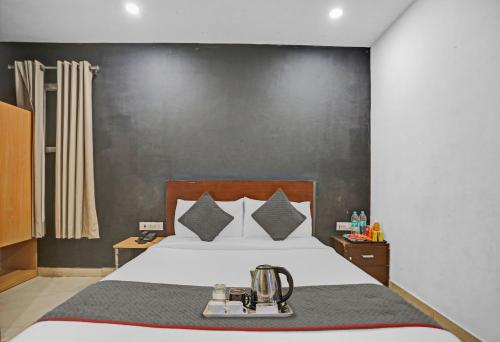 a bedroom with a bed with a blender on it at Townhouse Nangal Raya Pankha Road in New Delhi