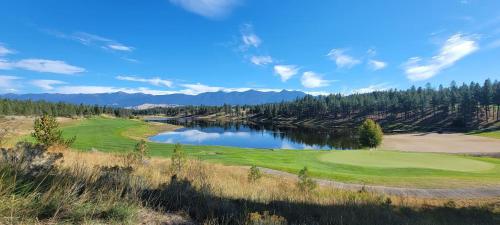 an aerial view of a golf course with a lake at Wilderness Club Cottage on 18th Green in Eureka