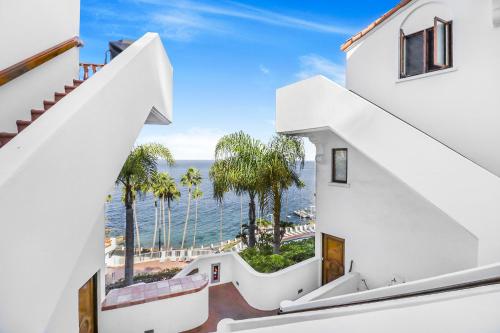 a view of the ocean from the stairs of a house at H228 - Hamilton Cove Villa 2-28 in Avalon