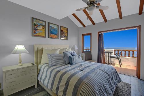 a bedroom with a bed with a view of the ocean at H246 - Hamilton Cove Villa 2-46 in Avalon