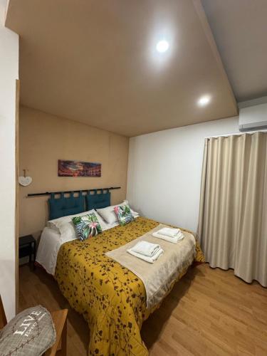 A bed or beds in a room at ORTIGIA 26