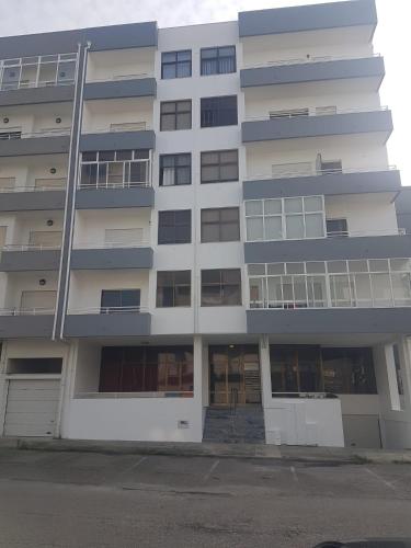 a tall apartment building with a lot of windows at Apartamento T2 Amorosa Beach in Viana do Castelo
