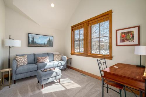 a living room with a couch and a table at The Porches in Steamboat Springs