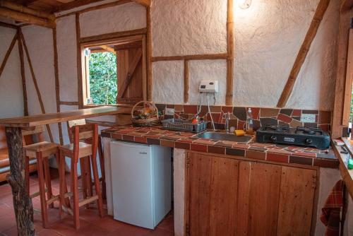 a kitchen with a counter and a sink in a room at Casa Entera Finca Cometa in San Agustín