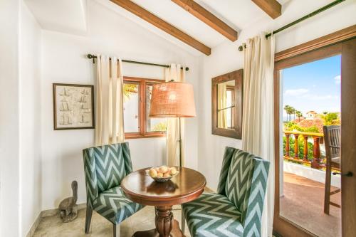 a dining room with a table and chairs and a window at H412 - Hamilton Cove Villa 4-12 in Avalon