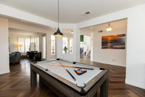 a pool table in the middle of a living room at Vineyard estate with pool and amazing views in Yucaipa