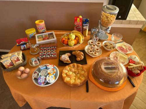 a table with a bunch of food on it at 88 Miglia in La Spezia