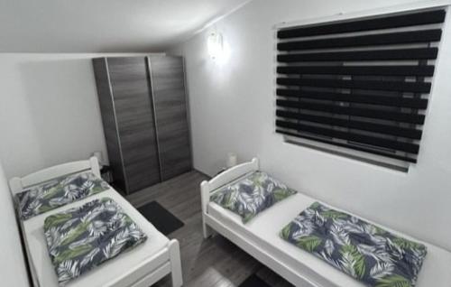 Postel nebo postele na pokoji v ubytování Casa Cartolina - Opatija by Villas Guide