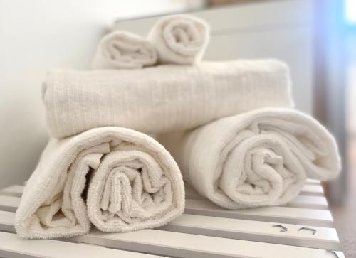 a pile of towels sitting on top of a table at Spacious Millpark Apartment in Donegal