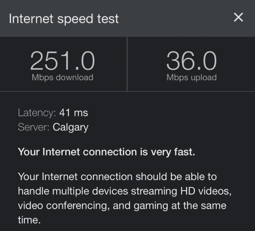 a screenshot of a cell phone screen with a speed test at W118 NEW! Central Canmore- Light Industrial Hotel Room in Canmore