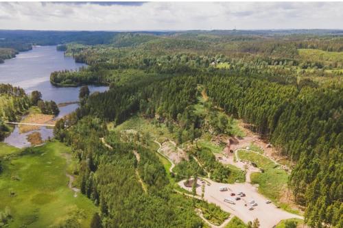an aerial view of a river and trees at Charlines cozy Pensionat in Svenljunga