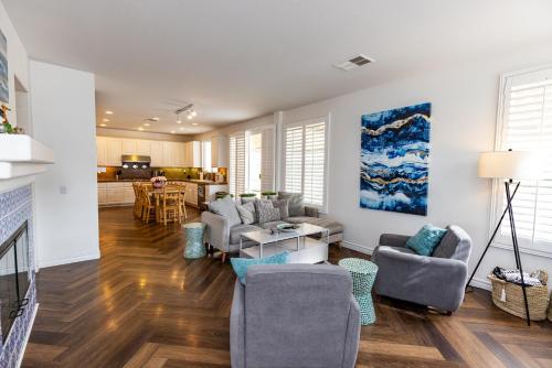 a living room with a couch and chairs and a table at Vineyard estate with pool and amazing views in Yucaipa