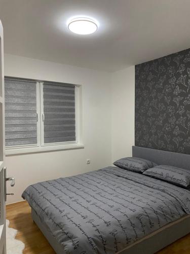 Silver Spa Apartmentにあるベッド