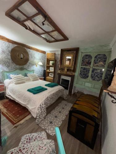 a bedroom with a large bed in a room at Casa rural en Buendía -la Galera con 4 dormitorios in Buendía