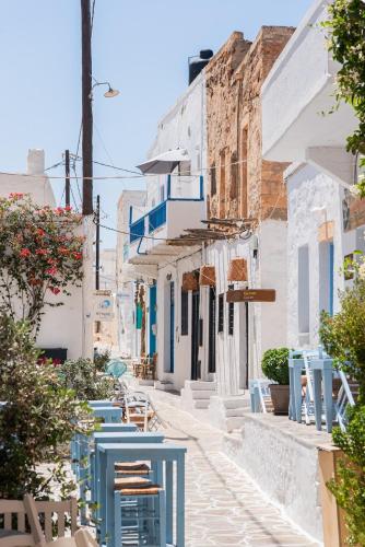 a street in positano with blue and white houses at Kimolos Heart Traditional Renovated House in Kimolos