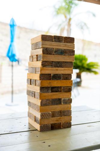 a stack of wood blocks sitting on a table at Vineyard estate with pool and amazing views in Yucaipa