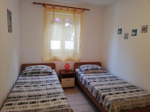 Postel nebo postele na pokoji v ubytování APARTMENT SANJA