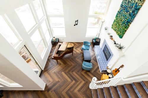 an overhead view of a living room with wood floors and ceilings at Vineyard estate with pool and amazing views in Yucaipa