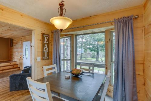 a dining room with a table and a large window at Mountain Retreat with Fire Pit in Flat Rock! in Flat Rock