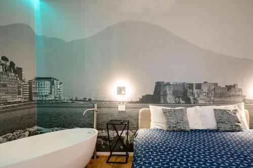 a bedroom with a bath tub and a bed and a bath tub at NILO RELAIS a san domenico maggiore in Naples