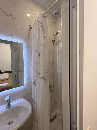 a bathroom with a sink and a shower at Guest House MD in Halidzor