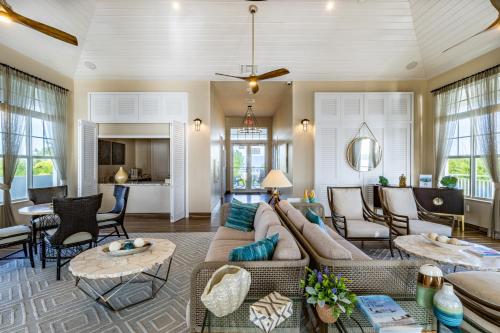 a living room with a couch and tables at Hideaway #23 in Key Largo
