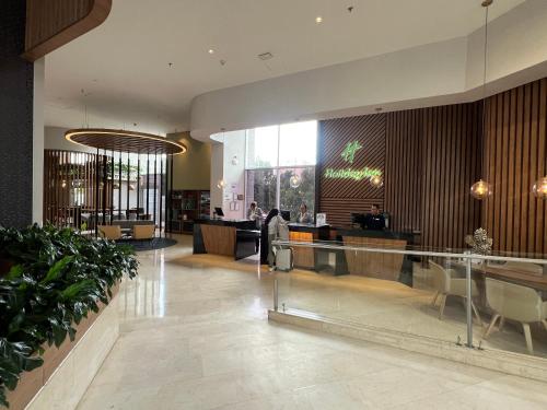 a lobby of a hotel with a reception desk at Holiday Inn Bogota Airport by IHG in Bogotá