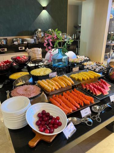 a buffet filled with lots of different types of food at Holiday Inn Bogota Airport by IHG in Bogotá