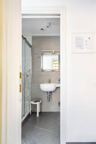a bathroom with a sink and a shower at ALBERTA Rooms Manarola in Manarola