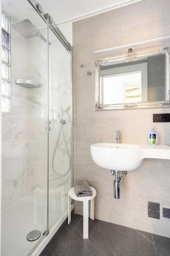 a bathroom with a sink and a shower at ALBERTA Rooms Manarola in Manarola