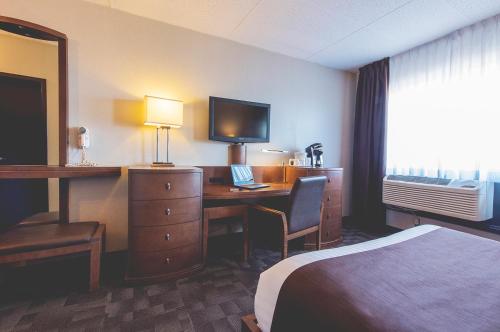 Postel nebo postele na pokoji v ubytování Hotel Continental Centre-Ville