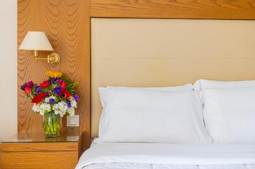 Postel nebo postele na pokoji v ubytování Hotel Aspassia