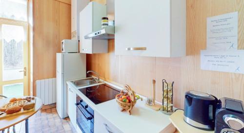 a kitchen with a sink and a refrigerator at Bellagio, Como Lake Breva - Como Lake in Bellagio